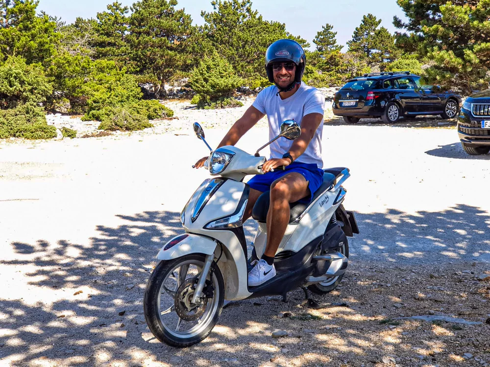 Ante, who writes and photographs Trogir Insider, on a rented scooter on Brač island