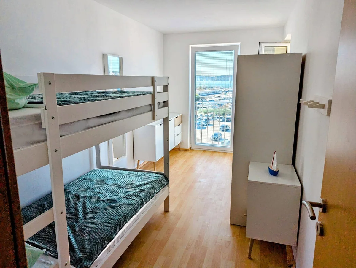 Bunk-bed bedroom with a sea view in the family-friendly Mornari Apartment 2.2, Seget Donji